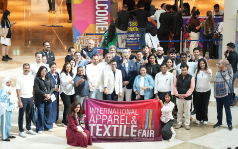 Crowd of people walking and browsing at a busy trade show exhibition
